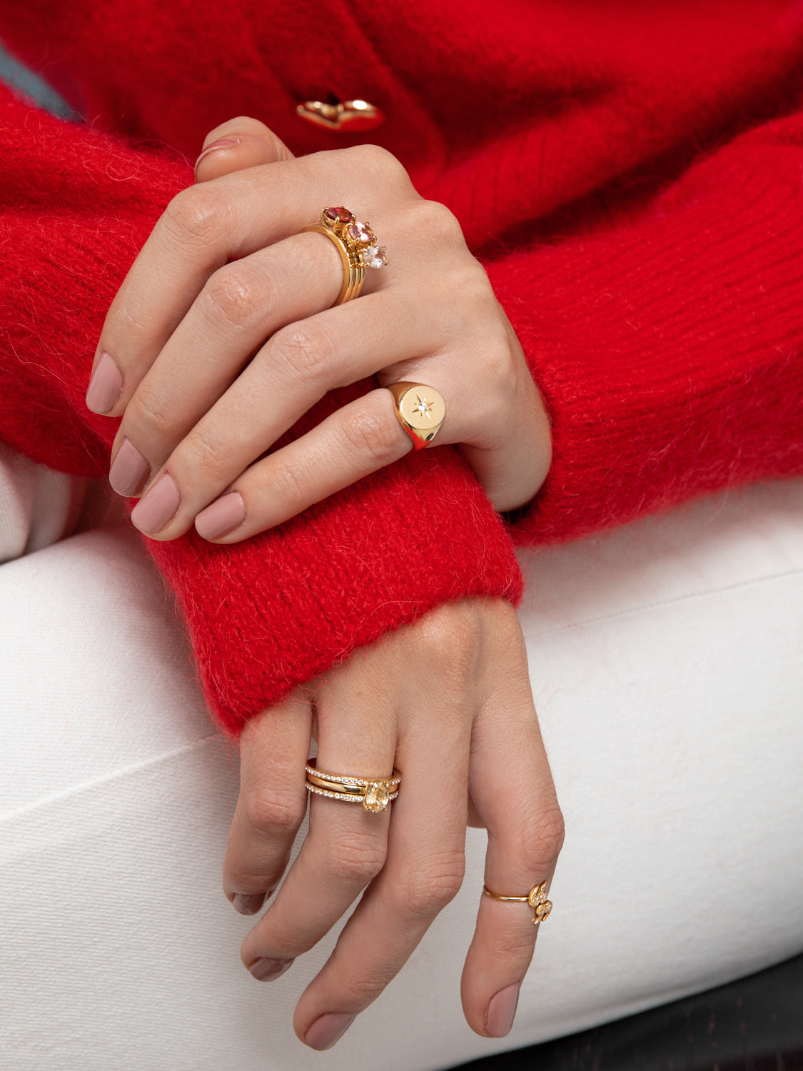 Lilian wearing the No. 1, No. 4, and No. 5 Rings stacked together, the North Star Signet Ring, Yellow Gold Diamond Ring, the No. 6 Ring and the Diamond Encrusted "Quote Un-Quote" Mini Spiral Ring by McFarlane Fine Jewellery