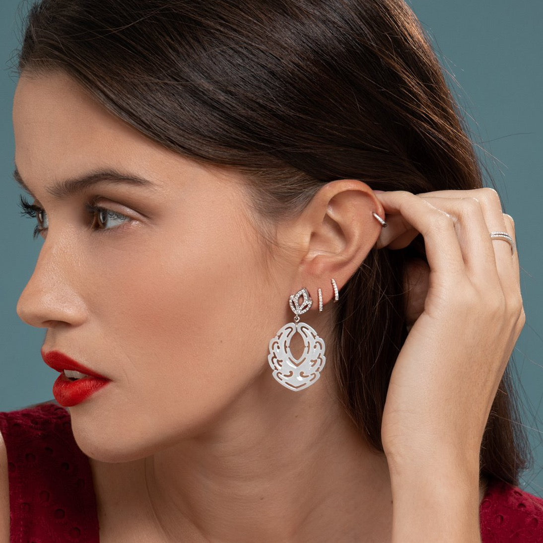 Lilian wearing the Diamond Lotus & White Jade Earrings, White Gold Diamond Huggies Medium and the White Gold Diamond Huggy Small by McFarlane Fine Jewellery