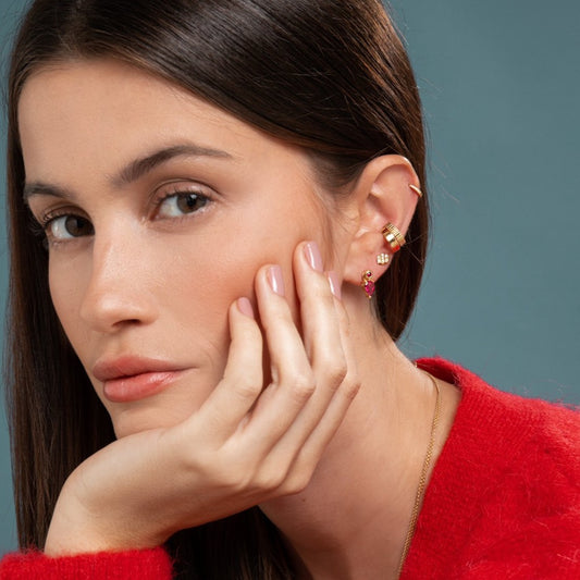 Lilian wearing the Yellow Gold Diamond Huggy Small, the Carved Gold Ear Cuff, the Gold Ear Cuff, the Triple Diamond Bar Studs and the Ruby Stud and Bright Pink Tourmaline Earring Pendant by McFarlane Fine Jewellery