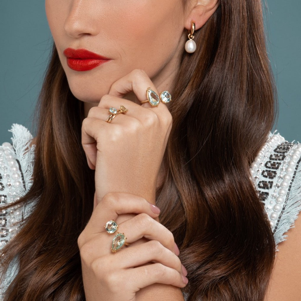 Lilian wearing the Chunky Polished Gold Hoops with Pearl Earrings Pendants, the Aquamarine and Prasiolite Duet Ring and the No. 2 and No. 3 Candy Coloured Rings by McFarlane Fine Jewellery