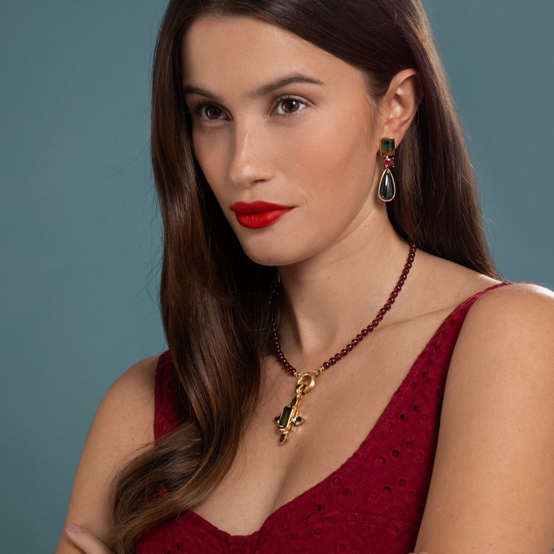 Lilian wearing the Tourmaline Earrings and Ruby and Tourmaline Cross Necklace by McFarlane Fine Jewellery
